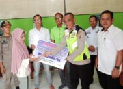 Anggota Polsek Belitang II Hadiri Penyaluran BLT DD Purwo Rejo