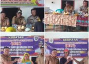 Anggota Polsek Semendawai Suku III Hadiri Giat Penyaluran BLT di Desa Burnai Jaya